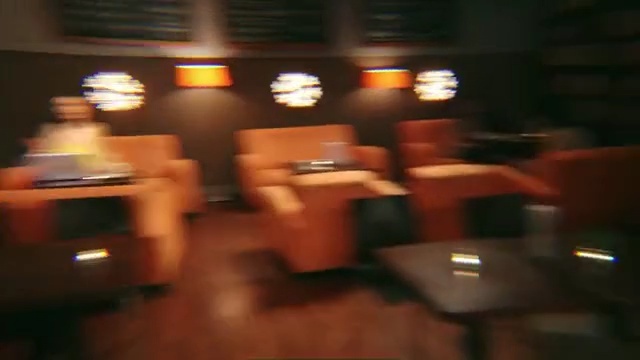 Video Reference N0: Restaurant, Room, Lighting, Table, Building, Function hall, Bar, Hardwood, Furniture, Business, Indoor, Living, Blurry, Sitting, Man, Food, Riding, Woman, Red, People, Person