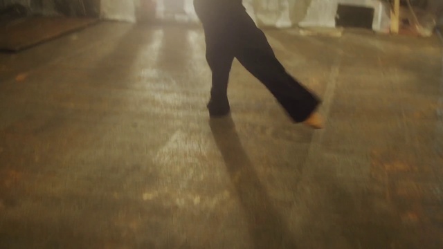 Video Reference N12: Floor, Flooring, Leg, Hardwood, Footwear, Human leg, Wood, Joint, Ankle, Human body, Person, Building, Walking, Man, Riding, Holding, Street, Standing, Carrying, Woman, Pulling, Rain, Young, Night, Umbrella, Wet, Board, Yellow, Suitcase, Game, Luggage, City, White, Dog, Blurry, Room, Dance, Clothing, Trousers