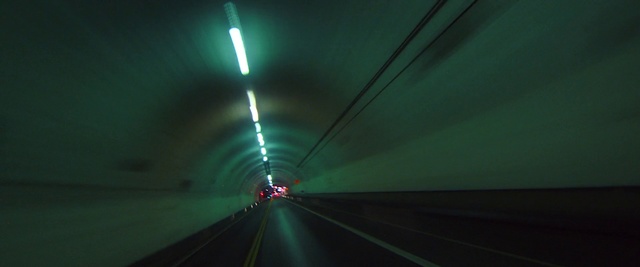 Video Reference N1: Green, Tunnel, Road, Light, Highway, Infrastructure, Lane, Mode of transport, Freeway, Darkness