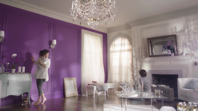 Video Reference N1: room, purple, interior design, property, living room, ceiling, home, furniture, function hall, dining room, Person