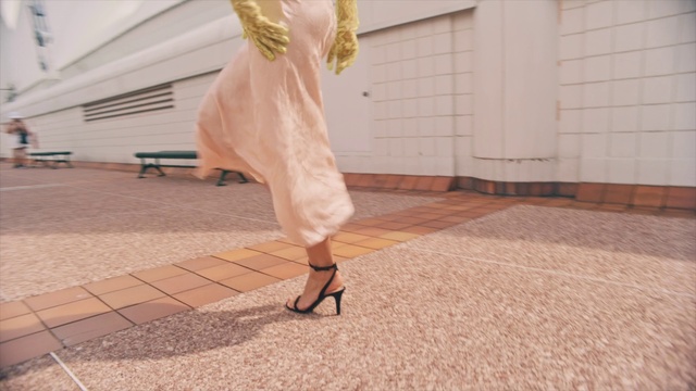 Video Reference N0: Clothing, Pink, Leg, Dress, Yellow, Fashion, Footwear, Waist, Ankle, Floor