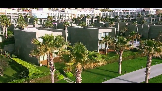 Video Reference N1: Residential area, Property, Urban design, Building, Architecture, Real estate, Condominium, Palm tree, Tree, Mixed-use