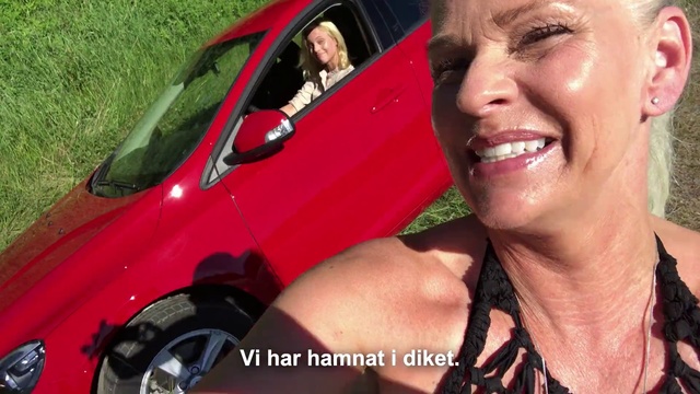 Video Reference N4: Vehicle door, Car, Vehicle, Photography, Compact car, Smile, Person, Outdoor, Grass, Smiling, Red, Posing, Woman, Man, Wearing, Front, Holding, Black, Camera, Truck, Talking, Standing, Large, Motorcycle, Driving, Young, Riding, White, Bus, Hot, Phone, Street, Parked, Mirror, Human face, Land vehicle, Clothing, Wheel