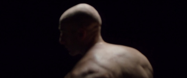 Video Reference N3: Black, Barechested, Head, Arm, Darkness, Nose, Male, Human, Chin, Muscle