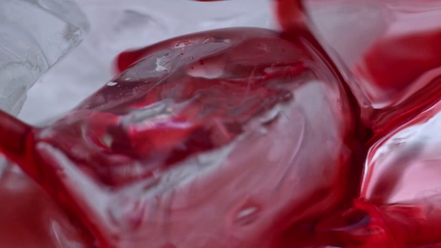 Video Reference N6: Water, Red, Close-up, Flesh, Fluid, Food, Liquid, Person, Table, Indoor, Cup, Plastic, Sitting, Pair, Close, Glass, Fork, Plate, White, Hotdog, Pink, Fruit, Covered, Cheese, Hot, Bun, Cake, Sandwich, Drop, Droplet, Splash, Abstract, Carmine