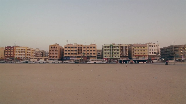 Video Reference N2: body of water, beach, sky, urban area, sea, shore, sand, city, horizon, residential area