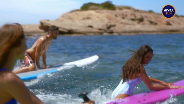 Video Reference N1: Fun, Surfing equipment, Vacation, Surfboard, Boardsport, Surface water sports, Surfing, Recreation, Wave, Leisure, Water, Outdoor, Person, Sport, Board, Beach, Ocean, Man, Young, Girl, Riding, Small, Woman, People, Mountain, Standing, Playing, Pink, Body, Little, Holding, Close, Boat, Boy, Group, Laying, White, Catch, Sky, Swimming, Water sport, Lake, Swimwear
