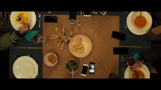 Video Reference N0: Food, Cuisine, Dish, Comfort food, Person, Indoor, Table, Photo, Items, Sitting, Small, Different, Man, Plate, Various, Several, Holding, Bunch, Wooden, Orange, Many, Room, White, Group, Clock, Screenshot