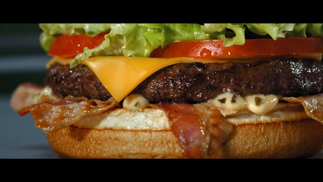 Video Reference N3: Dish, Food, Cuisine, Junk food, Fast food, Buffalo burger, Ingredient, Hamburger, Cheeseburger, Whopper, Person