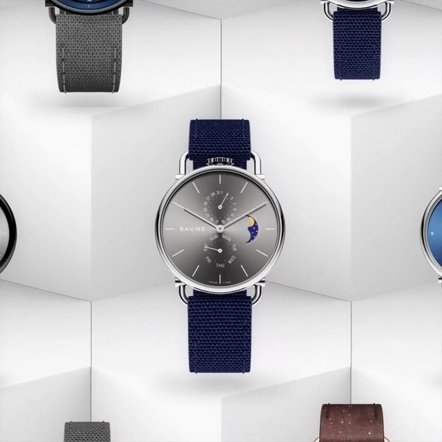 Video Reference N4: Watch, Analog watch, Blue, Watch accessory, Fashion accessory, Material property, Strap, Brand, Silver, Jewellery, Indoor, Thing, Table, Sitting, Hanging, Desk, White, Room, Computer, Man, Display, Standing, Clock, Store, Sink, Wall, Design