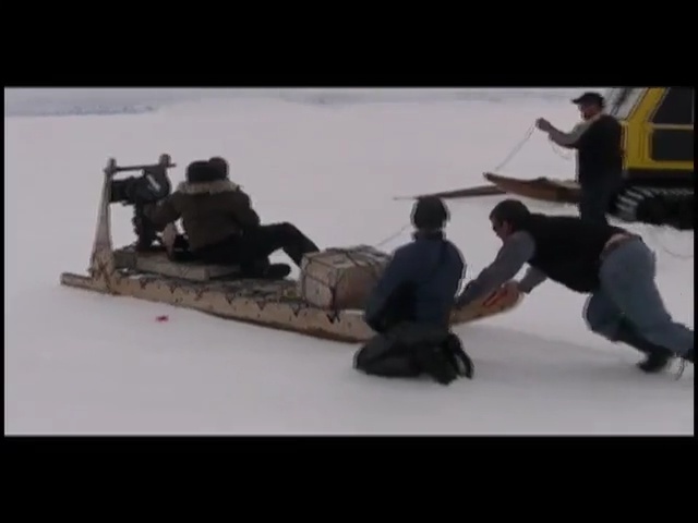 Video Reference N2: mode of transport, sled, vehicle, snow, recreation, asphalt, Person