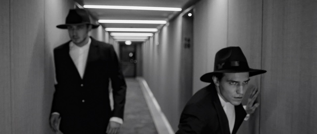 Video Reference N2: Photograph, White, Suit, Standing, Snapshot, Movie, Film noir, Formal wear, Monochrome photography, Hat