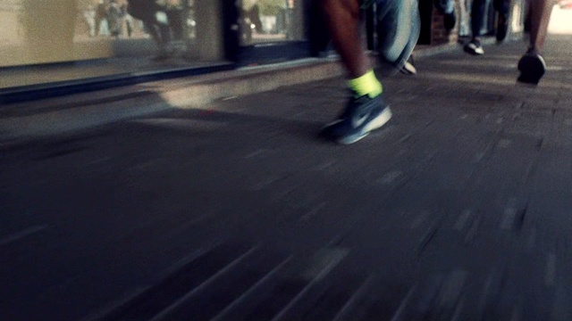 Video Reference N1: Black, Footwear, Yellow, Human leg, Shoe, Leg, Asphalt, Pedestrian, Street, Infrastructure, Person