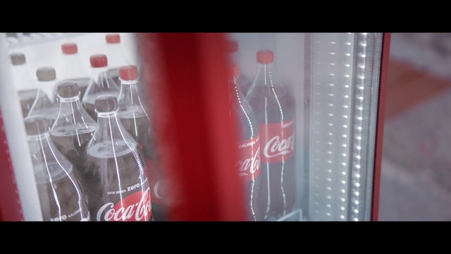 Video Reference N5: Coca-cola, Glass bottle, Red, Cola, Bottle, Drink, Text, Water, Carbonated soft drinks, Soft drink