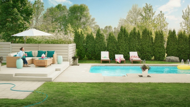 Video Reference N5: swimming pool, property, leisure, backyard, yard, estate, grass, house, real estate, home, Person