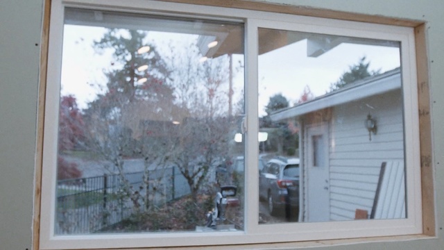 Video Reference N3: window, property, home, house, door, sash window, siding, real estate, facade, glass, Person