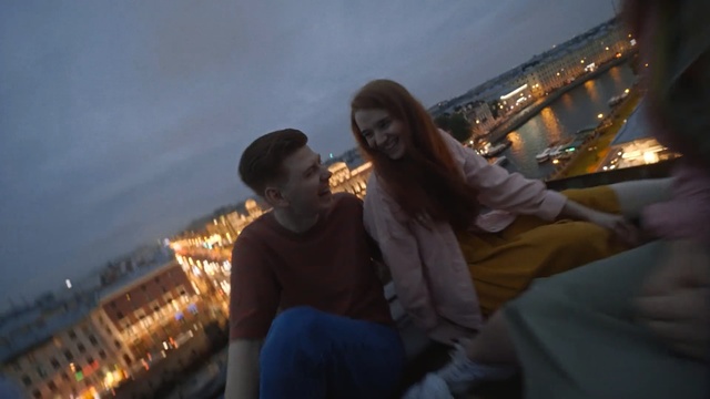 Video Reference N0: Sky, Yellow, Vacation, Tourism, Photography, Interaction, City, Fun, Night, Smile, Person, Brass, Man, Woman, Looking, Sitting, Front, Standing, Young, Holding, Wearing, Board, Human face, Music, Clothing, Boy, Girl