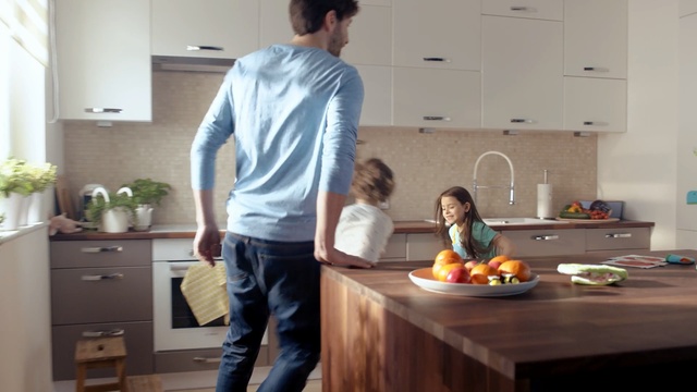 Video Reference N0: Kitchen, Room, Countertop, Standing, Furniture, Sitting, Food, Interior design, Meal, Flooring, Person