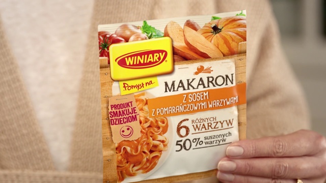 Video Reference N1: Food, Ingredient, Cuisine, Dish, Snack, Natural foods, Junk food, Convenience food, Produce, Indoor, Sitting, Table, Orange, Book, Box, Holding, Fast food, Text, Vegetable, Menu, Staple food, Vegetarian food, Carrot, Fruit