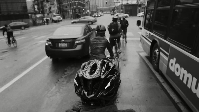 Video Reference N1: Motor vehicle, Mode of transport, Photograph, Vehicle, Helmet, Transport, Personal protective equipment, Traffic, Lane, Black-and-white, Person