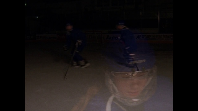 Video Reference N14: Black, Darkness, Light, Night, Midnight, Fun, Photography, Space, Performance, Performance art, Man, Dark, Front, Sitting, Table, Standing, Woman, Young, Computer, Room, Riding, Playing, White, Street, People, Ice skating, Hockey, Person, Clothing, Sports equipment, Human face