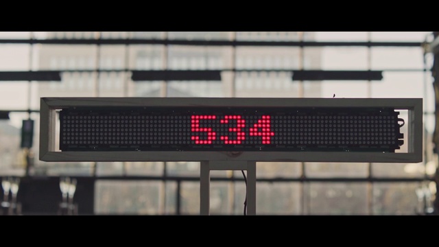 Video Reference N0: Display device, Led display, Electronic signage, Technology, Electronic device, Signage, Person, Indoor, Window, Red, White, Kitchen, Station, Large, Clock, Street, Train, Oven, Sign, Silver, Room, Bus, City, Standing, Text, Screenshot