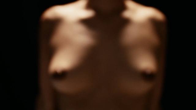 Video Reference N3: nose, darkness, chest, close up, trunk, muscle, barechestedness, human body, abdomen, neck