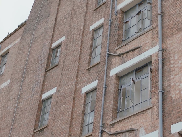 Video Reference N1: building, brickwork, property, wall, brick, architecture, neighbourhood, facade, window, residential area