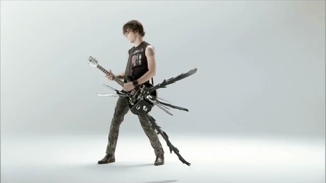 Video Reference N0: Action figure, Guitarist, Figurine, Musician, Gun, Musical instrument, Guitar, Electric guitar, Person