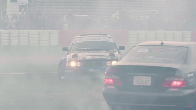 Video Reference N16: Vehicle, Car, Atmospheric phenomenon, Mode of transport, Mid-size car, Winter storm, Haze, Automotive window part, Drifting, Sports sedan