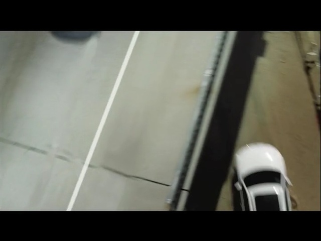 Video Reference N1: black, white, mode of transport, light, lighting, floor, material, line, flooring, wood, Person
