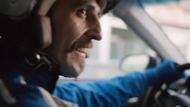 Video Reference N3: Driving, Automotive design, Auto part, Mouth, Photography, Smile, Facial hair, Helmet, Beard, Vehicle