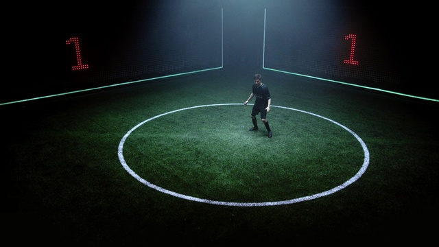 Video Reference N2: green, atmosphere, football, sport venue, light, player, ball, darkness, grass, line