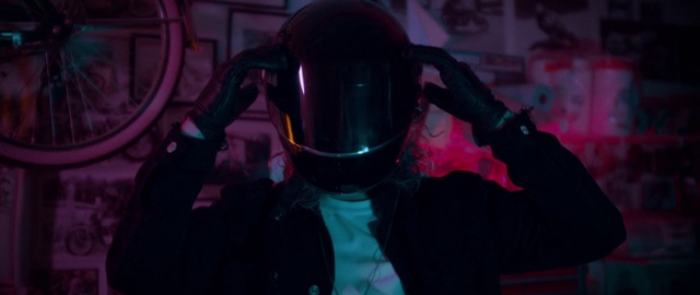Video Reference N0: Purple, Personal protective equipment, Violet, Magenta, Organism, Photography, Helmet, Space, Fictional character, Darkness, Person, Indoor, Sitting, Table, Computer, Laptop, Front, Food, Small, Dark, Holding, Room, Desk, Man, Young, Red, Keyboard, Playing, Stuffed, White, Mask