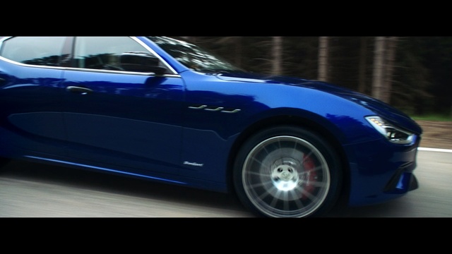 Video Reference N2: wheel, car, auto, automobile, vehicle, car wheel, speed, transportation, drive, fast, luxury, headlight, motor vehicle, machine, tire, transport, coupe, motor, sport, road, race, modern, power, style, design, sports car, expensive, sports, chrome, engine, automotive, model, mechanical device, shiny, new