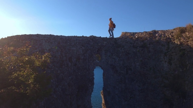 Video Reference N1: Cliff, Water, Terrain, Formation, Sky, Rock, Reflection, Klippe, Sea, Fault