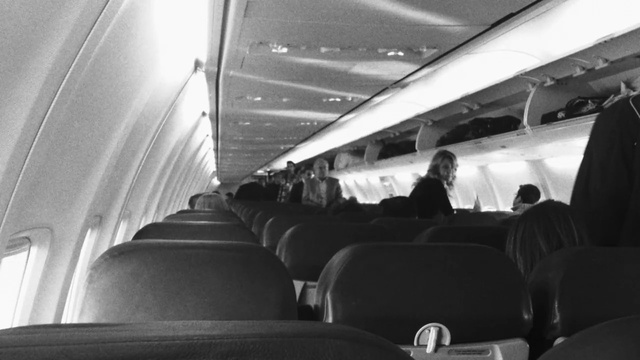Video Reference N3: Air travel, Airline, Passenger, Vehicle, Airplane, Aircraft cabin, Black-and-white, Monochrome, Airliner, Photography