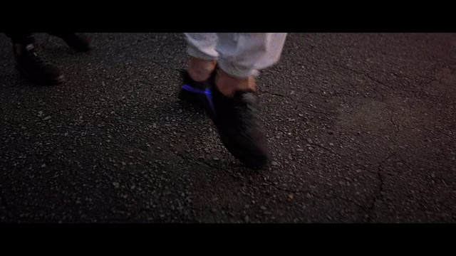 Video Reference N2: Black, Darkness, Footwear, Leg, Asphalt, Human leg, Brown, Foot, Shoe, Hand