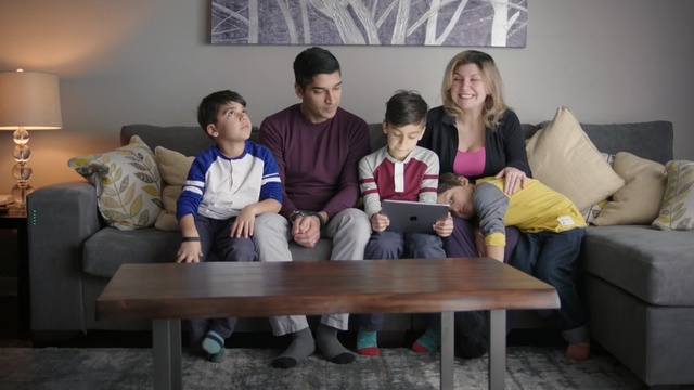 Video Reference N2: furniture, sitting, fun, couch, table, Person