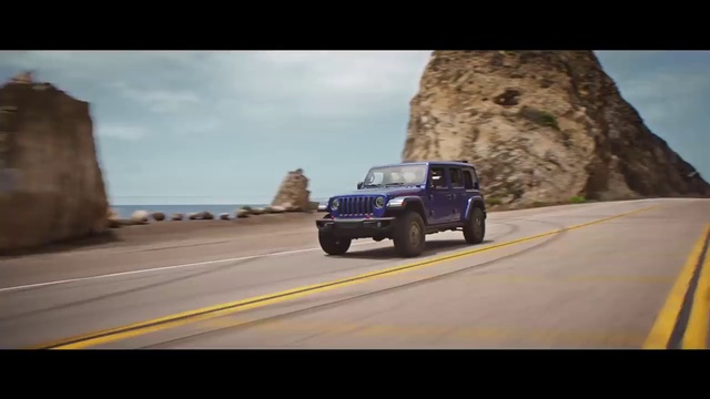 Video Reference N3: Land vehicle, Vehicle, Car, Jeep wrangler, Mode of transport, Off-road vehicle, Jeep, Automotive tire, Road trip, Road, Scene, Outdoor, Driving, Traveling, Mountain, Going, Highway, Photo, Truck, Riding, Man, Street, Coming, View, Yellow, Hill, Board, Doing, Jumping, Air, City, Flying, Traffic, Snow, Track, Trick, Blue, Way, Wheel, Text, Tire, Auto part, Sport utility vehicle, Pickup truck, Land rover