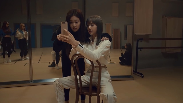Video Reference N0: Performance, Scene, Person, Indoor, Man, Holding, Woman, Table, Cellphone, Phone, Front, Mirror, Young, Room, Using, Standing, Laptop, Computer, White, Living, Playing, People, Floor, Clothing, Human face, Smile, Girl