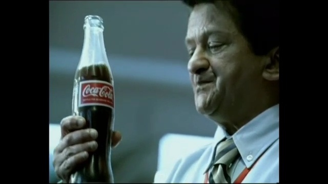 Video Reference N2: drink, cola, coca cola, soft drink, carbonated soft drinks, bottle, alcohol, Person