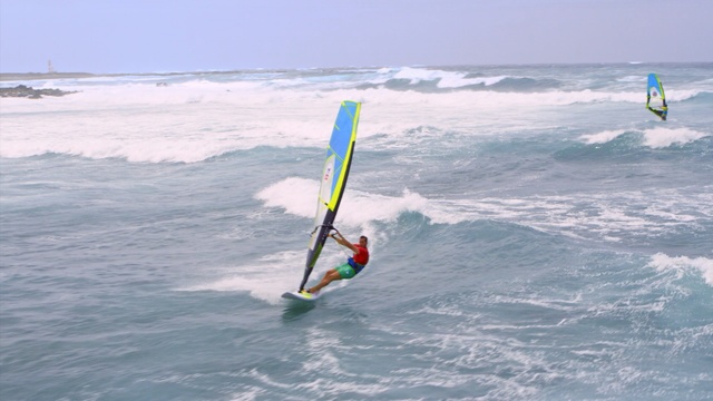 Video Reference N0: Surfing equipment, Windsurfing, Wave, Wind wave, Surface water sports, Wind, Recreation, Boardsport, Outdoor recreation, Water sport, Outdoor, Water, Sport, Surfing, Ocean, Man, Kite, Board, Riding, Holding, Young, Green, Standing, Beach, Girl, Body, Sky, Surfboard, Sports equipment, Windsports, Watercraft, Surf, Boat, Day