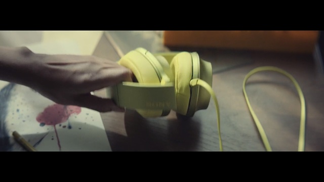 Video Reference N4: Headphones, Audio equipment, Yellow, Gadget, Technology, Hand, Plant, Ear, Photography, Electronic device