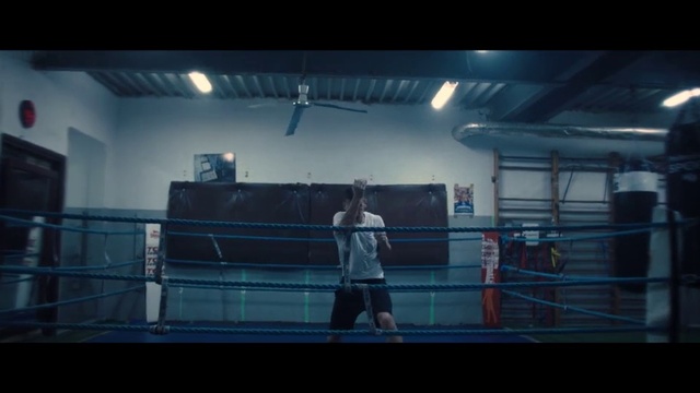 Video Reference N9: Boxing ring, Sport venue, Boxing, Boxing equipment, Striking combat sports, Contact sport, Professional boxing, Sports equipment, Individual sports, Indoor, Racket, Court, Holding, Woman, Standing, Man, Ball, Playing, Game, Player, Young, Girl, Large, Walking, Water, Room, Blue, White, Air, Person, Clothing