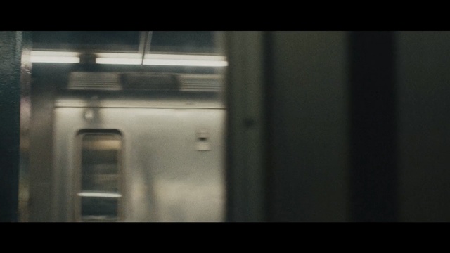 Video Reference N8: Snapshot, Architecture, Door, Darkness, Room, Photography, Glass, Window, House, Daylighting, Indoor, Object, Thing, Photo, White, Small, Sitting, Black, Silver, Subway, Man, Train, Standing, Kitchen, Refrigerator, Stainless, Oven, Display, Screenshot, Blur