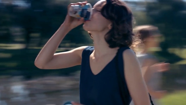 Video Reference N0: Water, Photograph, Shoulder, Beauty, Arm, Snapshot, Photography, Joint, Brown hair, Long hair, Person, Outdoor, Woman, Black, Girl, Young, Holding, Female, Lady, Street, Standing, Riding, Wearing, Phone, City, Walking, Blue, White, Playing, Player, Blurry, Human face, Sunglasses, Clothing, Soft drink