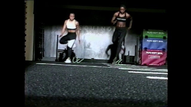 Video Reference N10: Standing, Physical fitness, Snapshot, Asphalt, Kettlebell, Advertising, Photography, Arm, Room, Footwear