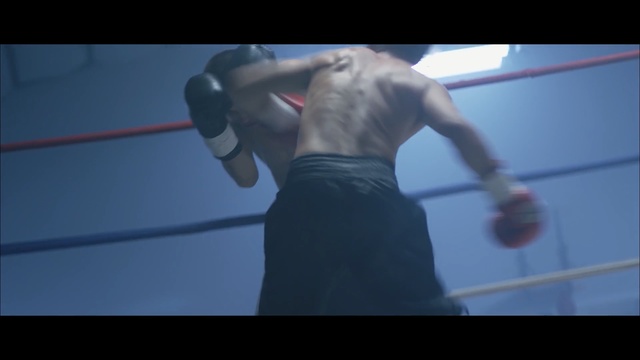 Video Reference N5: blue, black, boxing ring, boxing, boxing equipment, snapshot, pradal serey, arm, boxing glove, hand