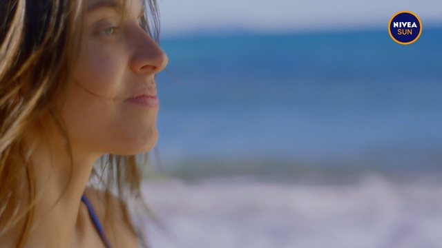 Video Reference N1: Face, Hair, Skin, Lip, Beauty, Chin, Head, Blond, Nose, Neck, Person, Outdoor, Holding, Woman, Water, Looking, Standing, Girl, Hand, Young, Cellphone, Front, Red, Sitting, Phone, Shirt, Beach, Close, Yellow, White, Ocean, Food, Blue, Street, Human face, Sky, Portrait